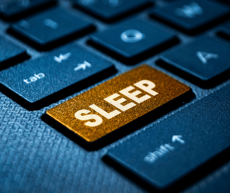 A keyboard with the word SLEEP on a gold button.